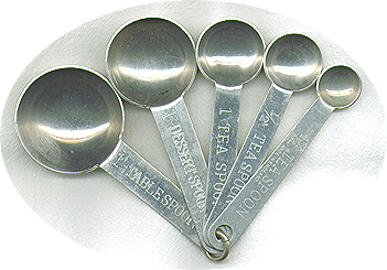 Stamped 'Made In England', set includes 'Dessertspoon' measurement which equals about two teaspoons.